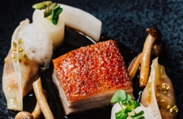 Caramelised suckling pig belly - Caramelised suckling pig belly, unagi gyoza, daikon, ma khaen pepper and tamarind jus
